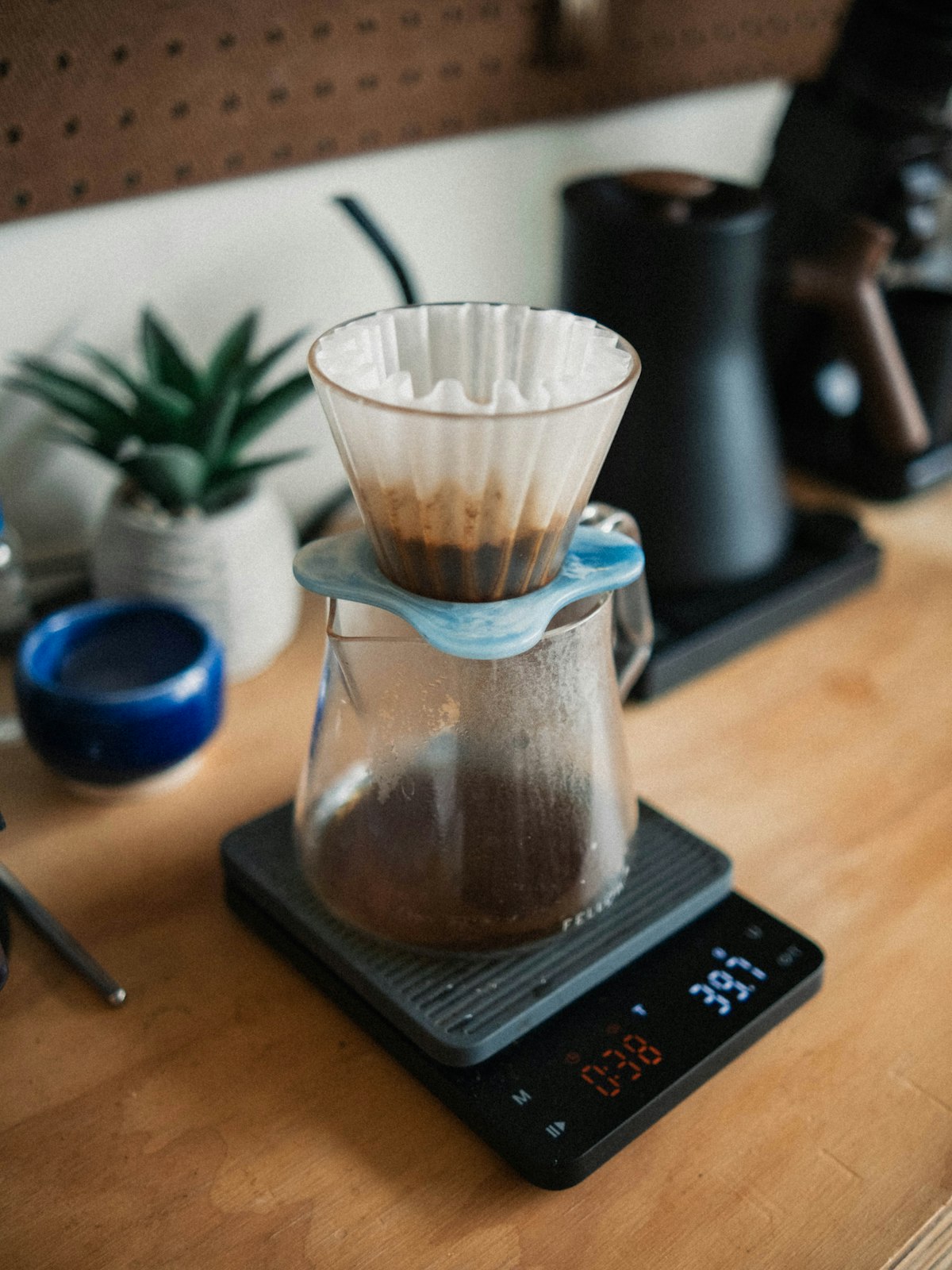 Pour-over coffee brewer resting on a digital scale
